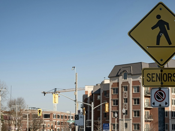An image of a senior's cross walk sign. Hamilton has a large senior population and might be a good place to downsize if you're wondering if hamilton is a good place to live.