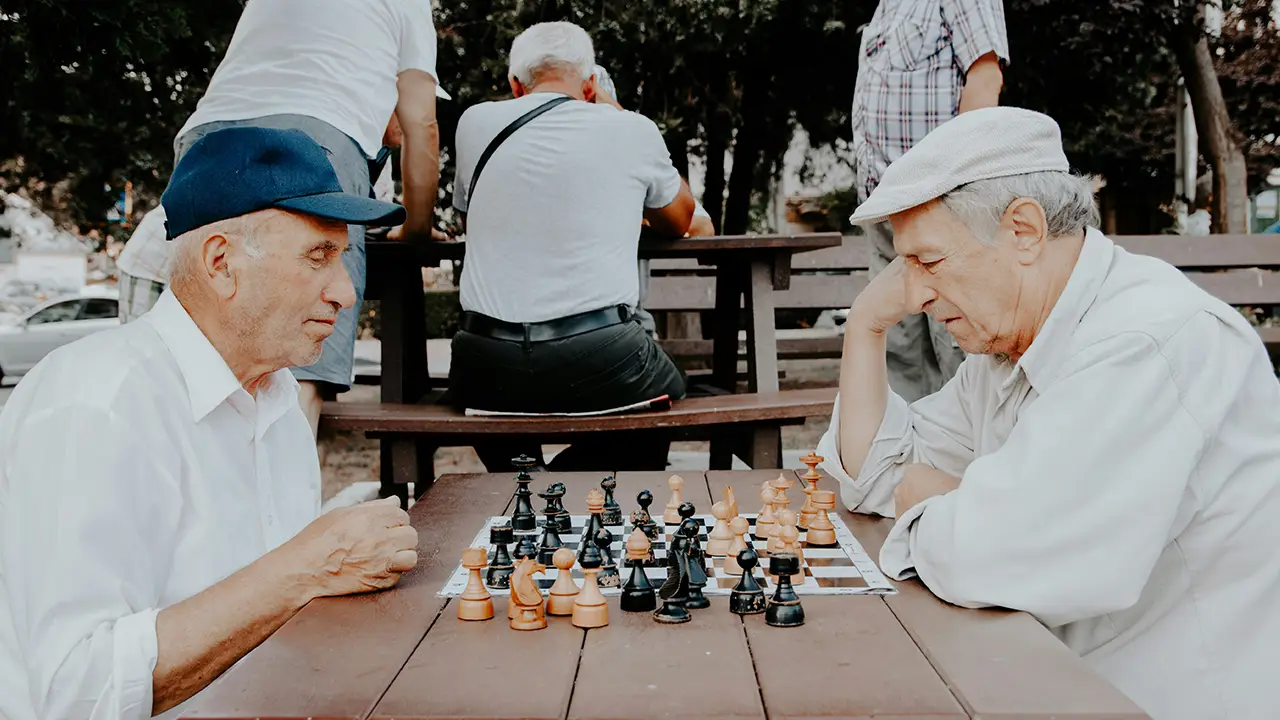 An image of two elderly men playing chess in Hamilton, Ontario.